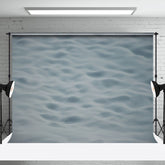 Aperturee - Hellgrauer Hintergrund für die Fotografie mit Meereswellenstruktur